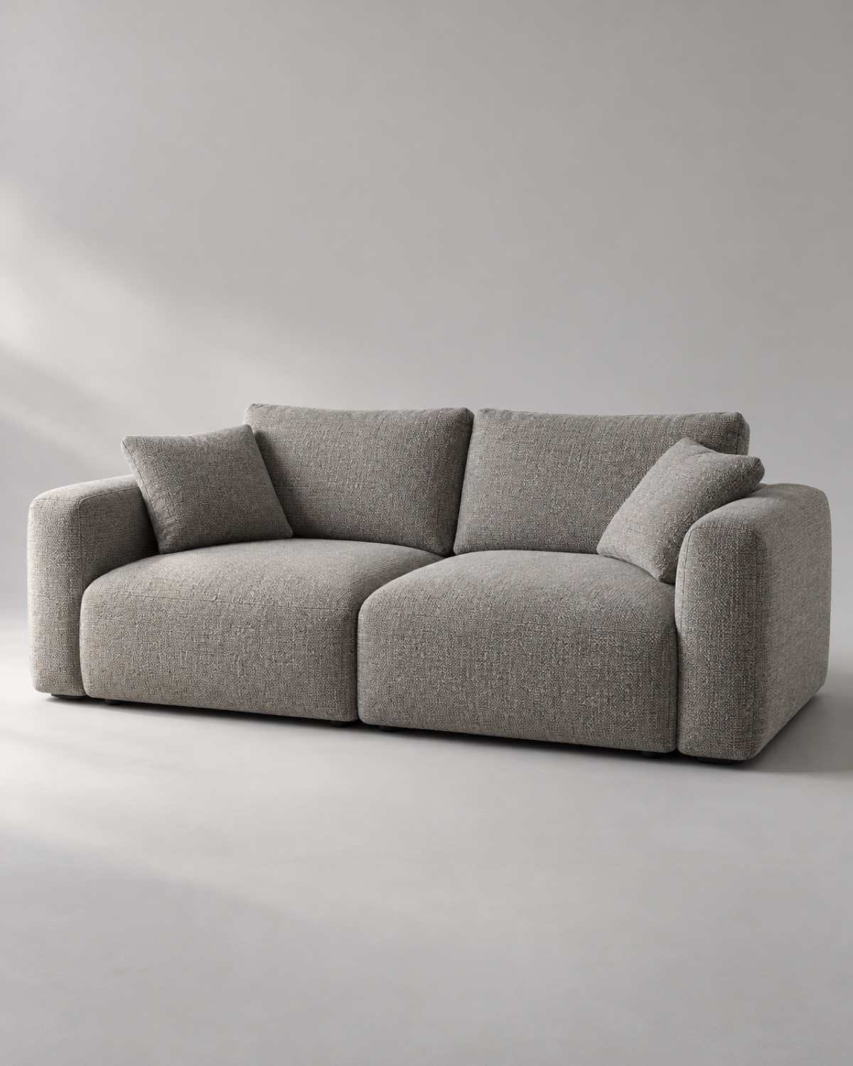 Low two-seat sofa in textured stone-gray upholstery