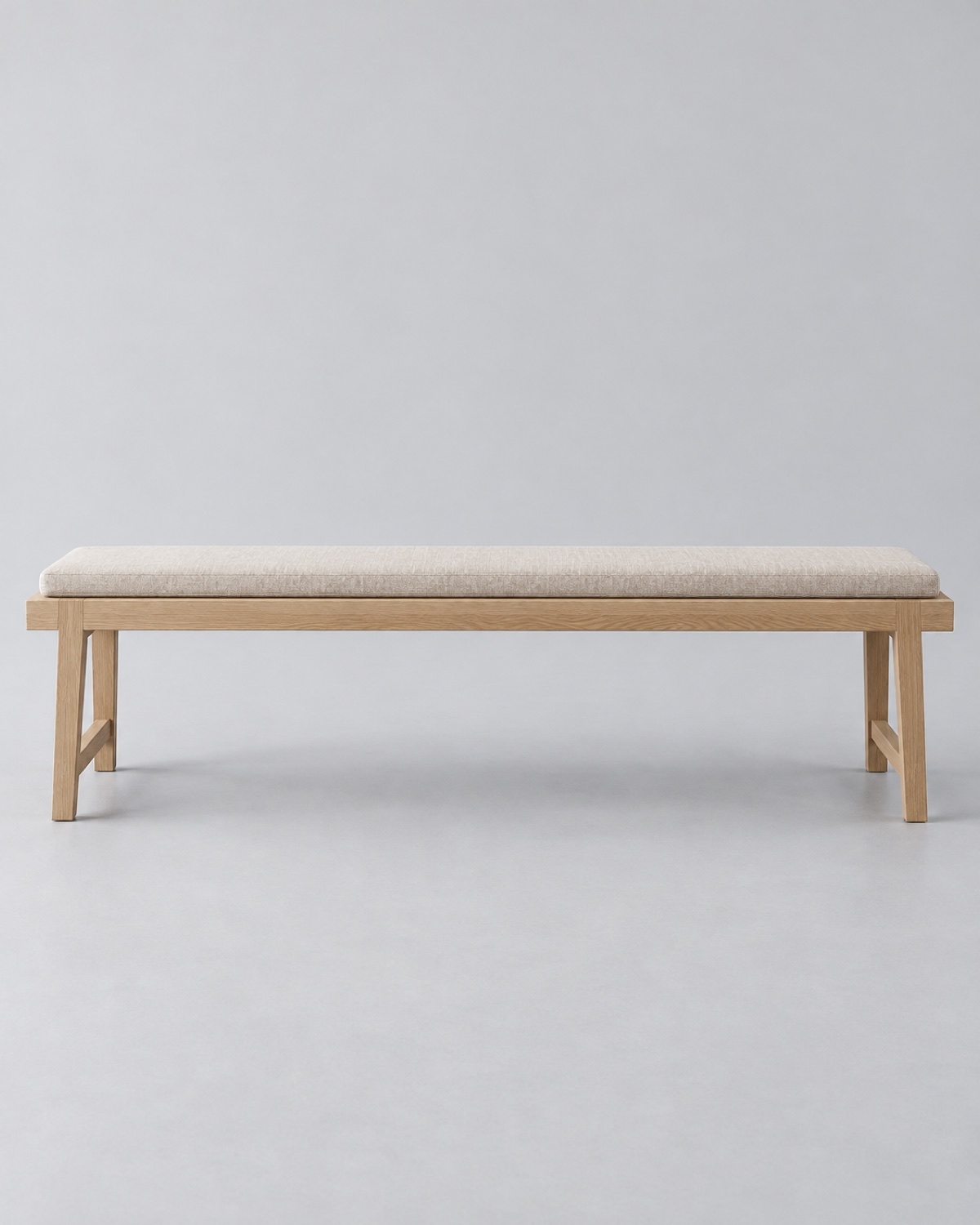 Long oak bench with a light linen seat