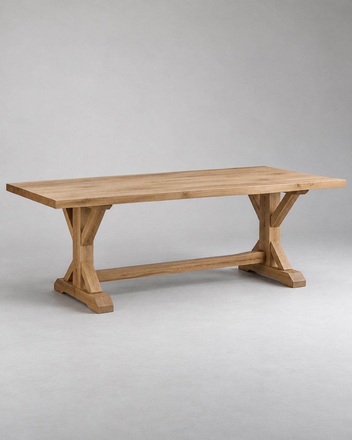 Large natural oak dining table with trestle base