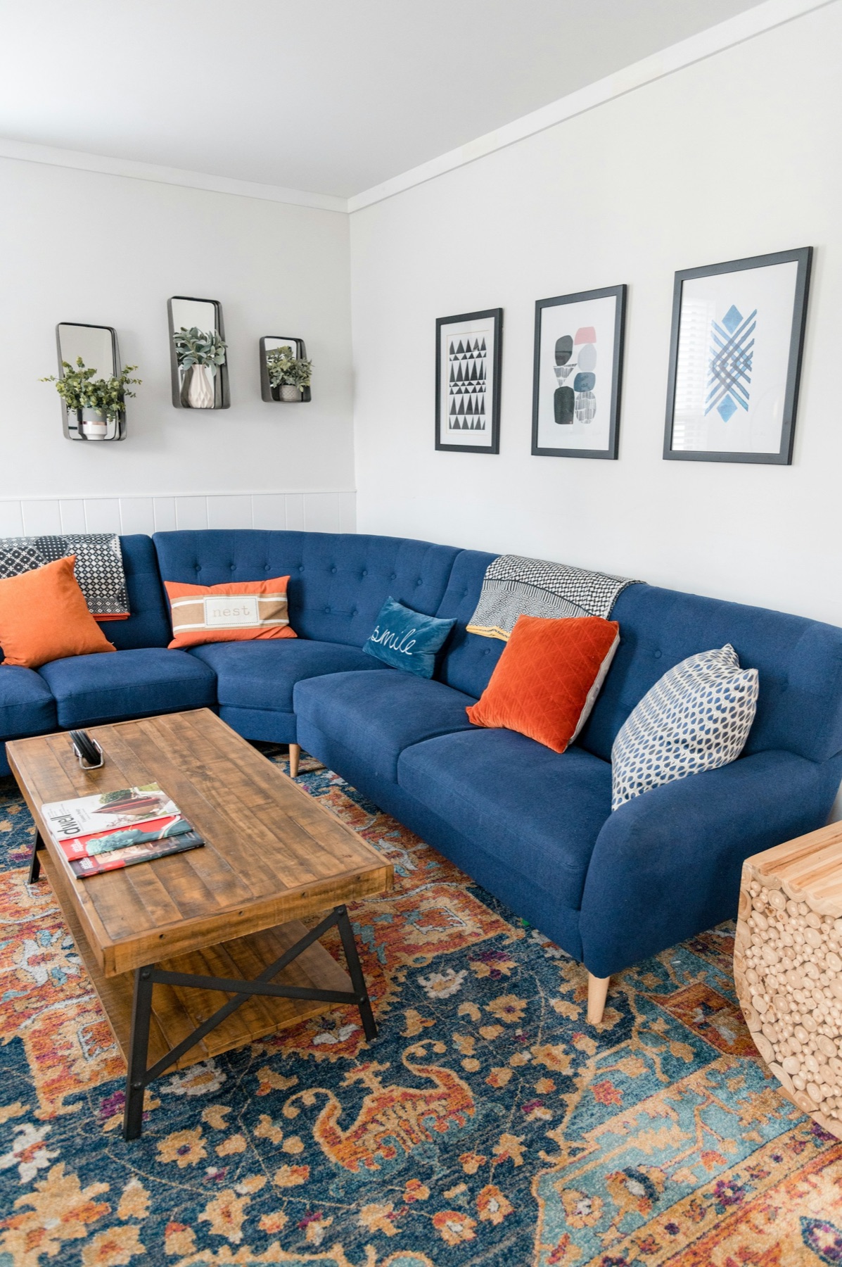 Wood coffee table beside a blue sofa